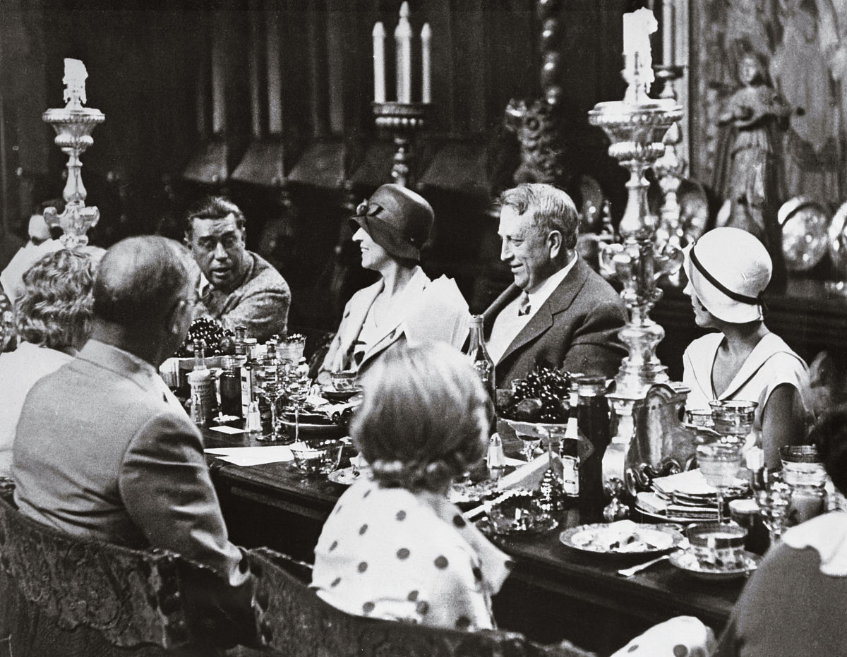 (original caption) william randolph hearst entertains dinner gue