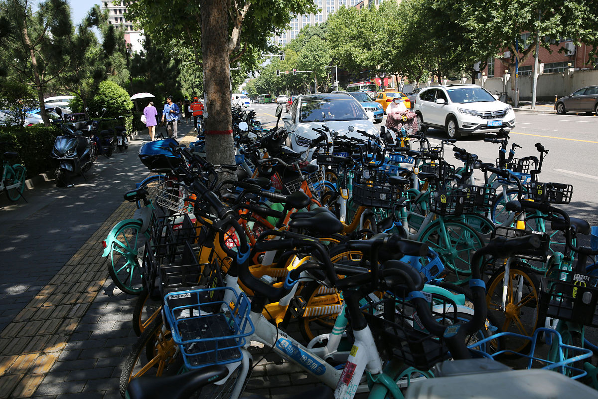 共享单车专用停车点被占用学生对乱摆乱放的共享单车毫不在意的问题进行分析和解决