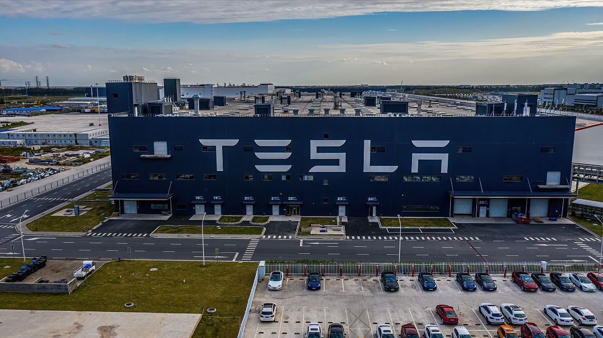 write an abstract of paper the title is Reasons for Tesla to Build a Factory in Shanghai Based on PEST analysisno more than 250 words