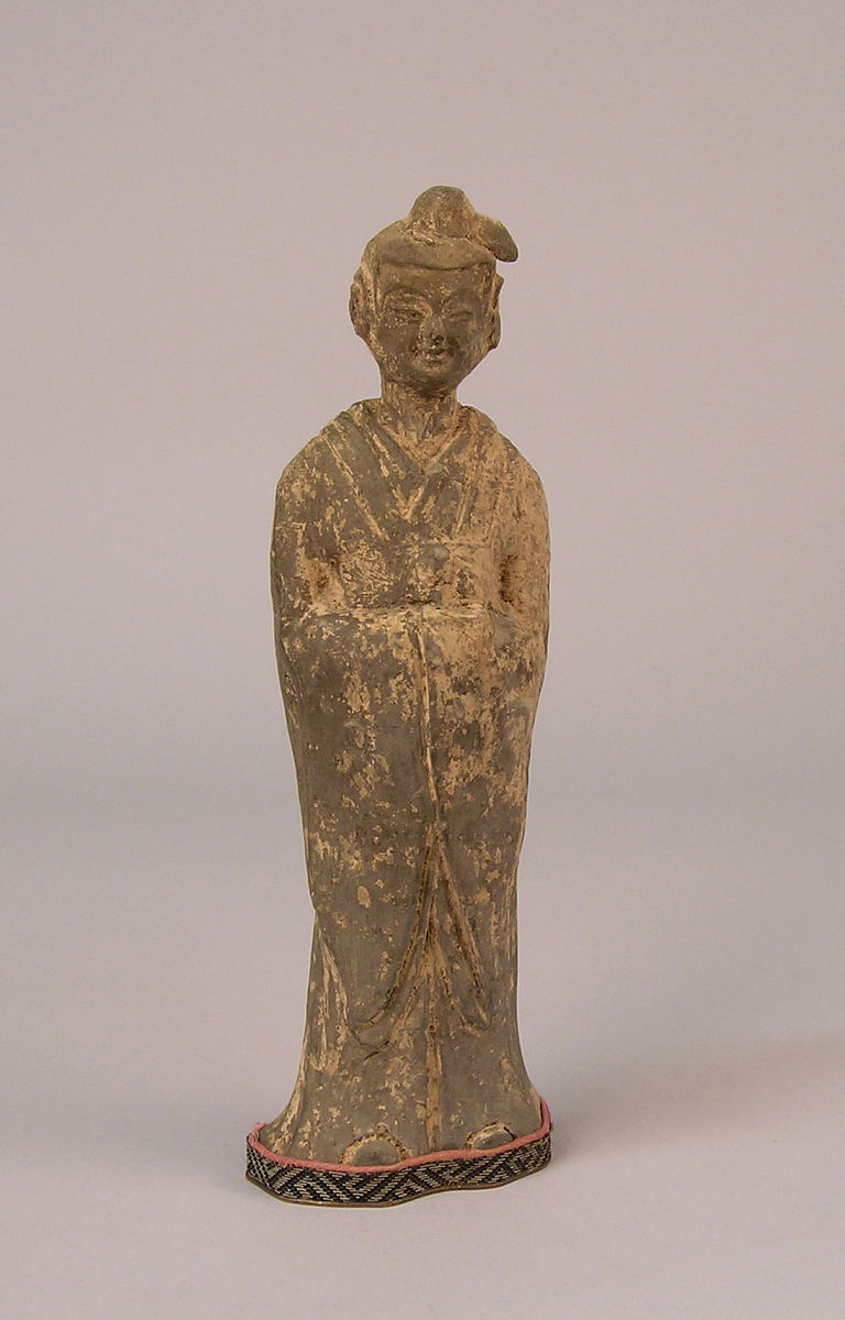 unglazed figure on fabric base with own case, china, wei dynasty