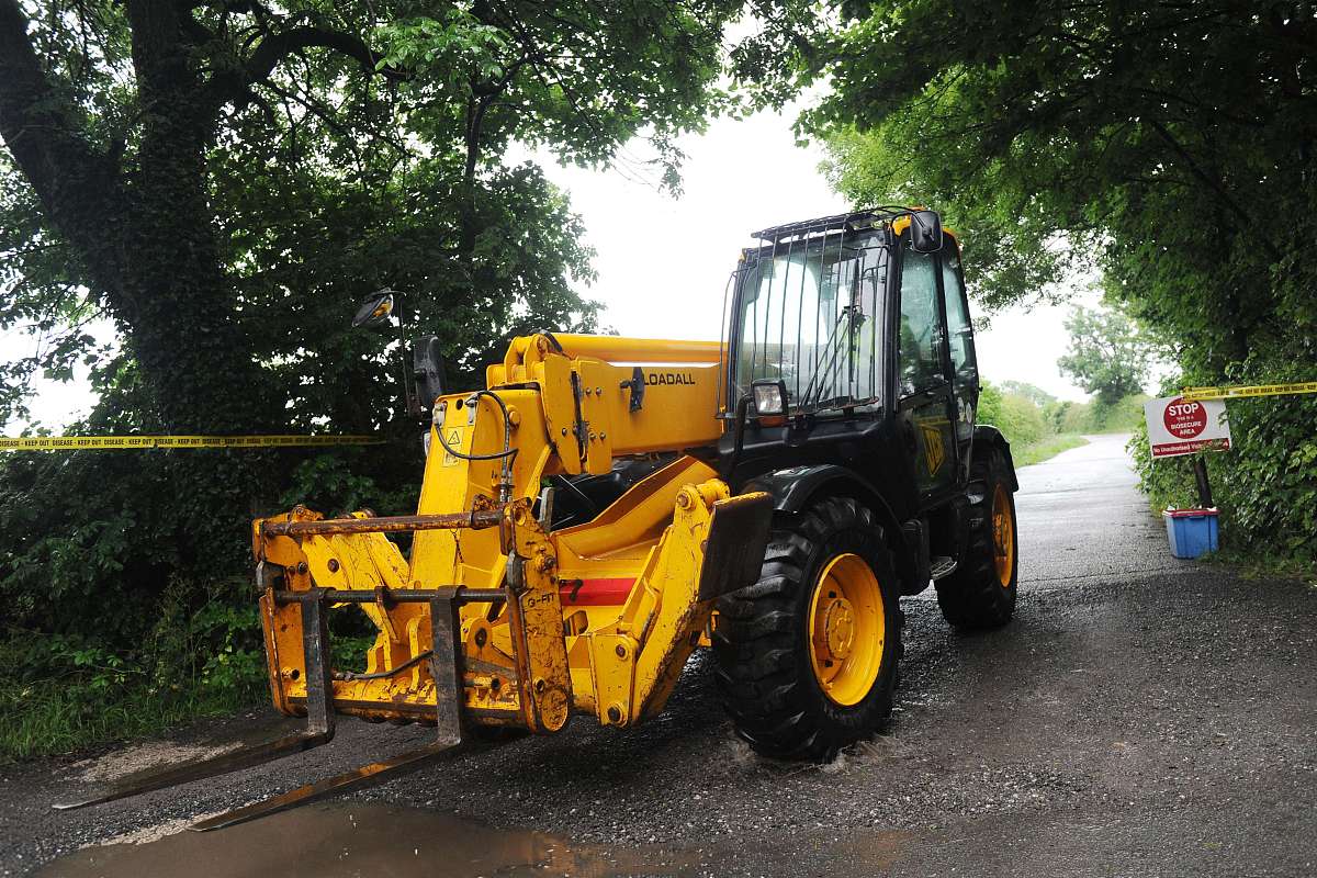 a telescopic forklift ve<strong>h</strong>icle leaves field foot farm where  n
