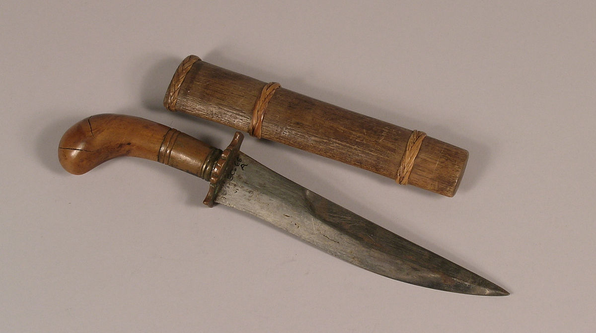 moro dagger with a carved wooden handle and sheath, philippines,