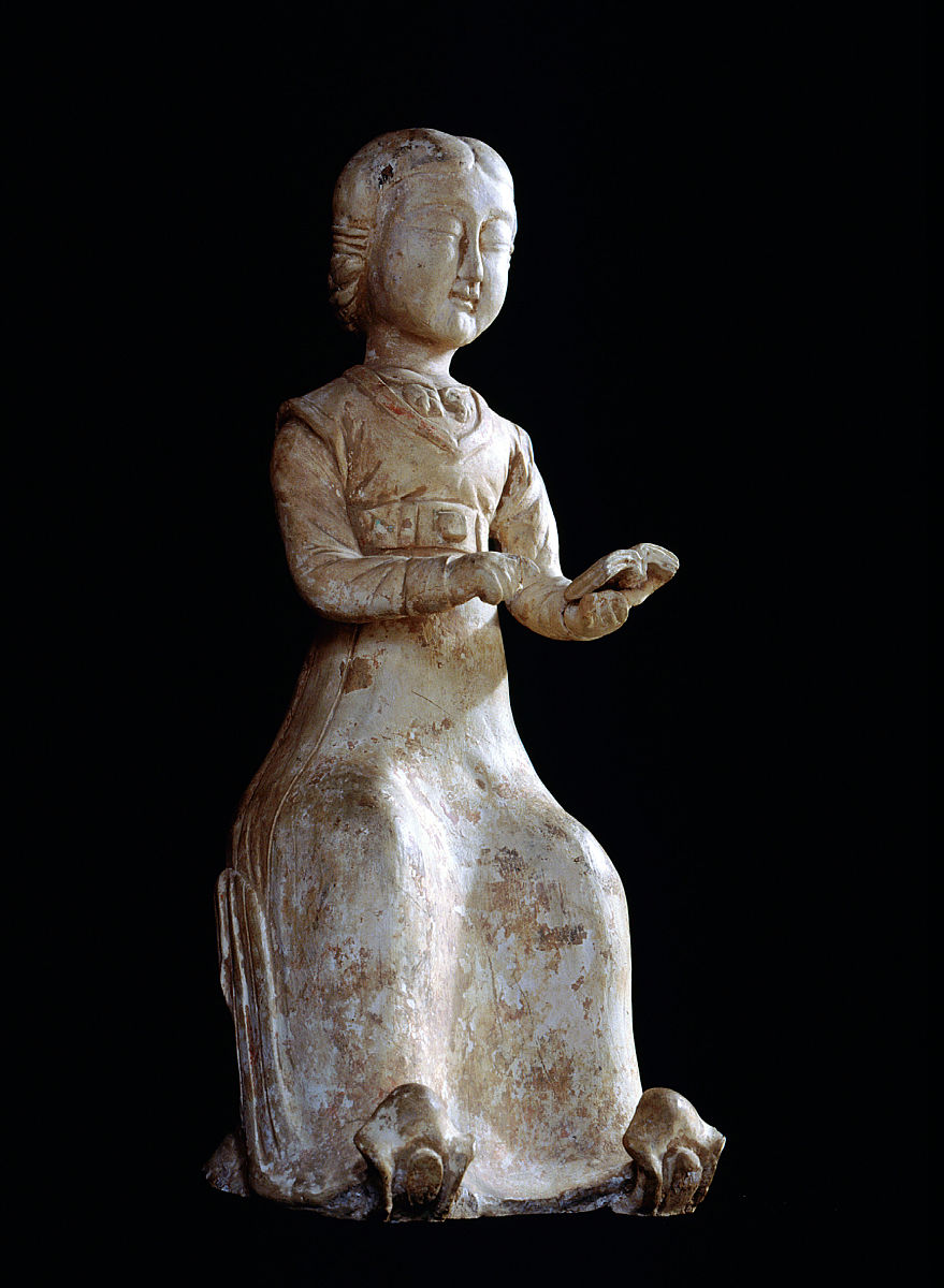 figure of a seated woman reading a book, bound volumes, familiar