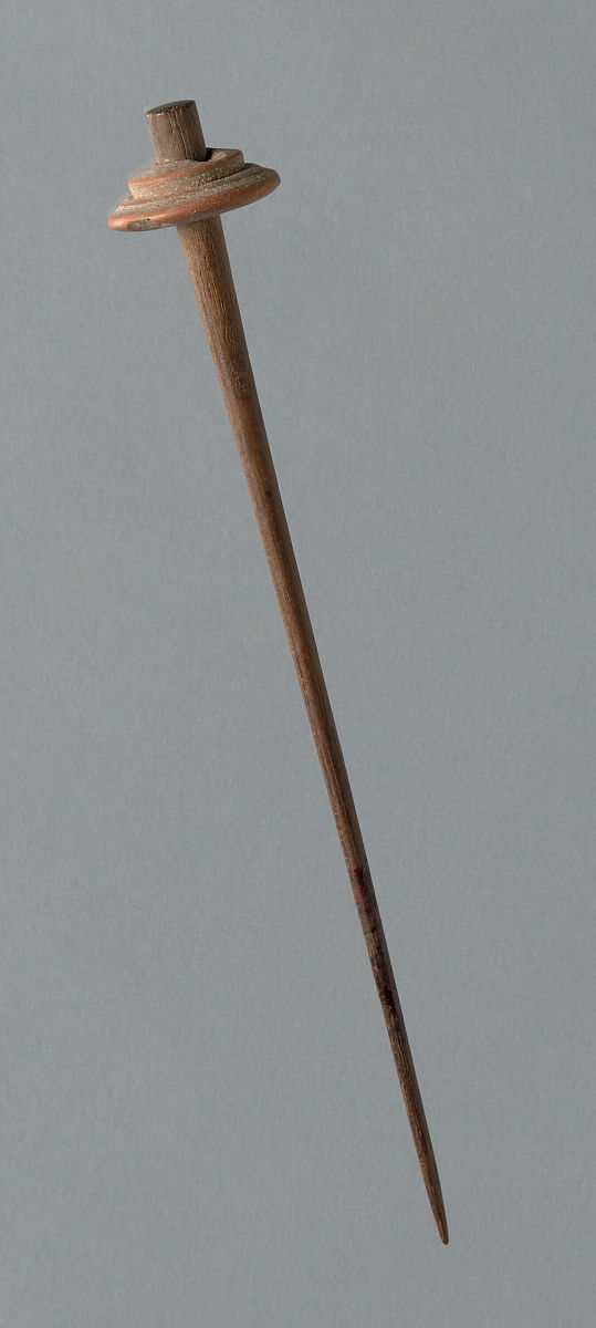 wooden spindle with ceramic whorl, peru, 1000/1476. artist unkno