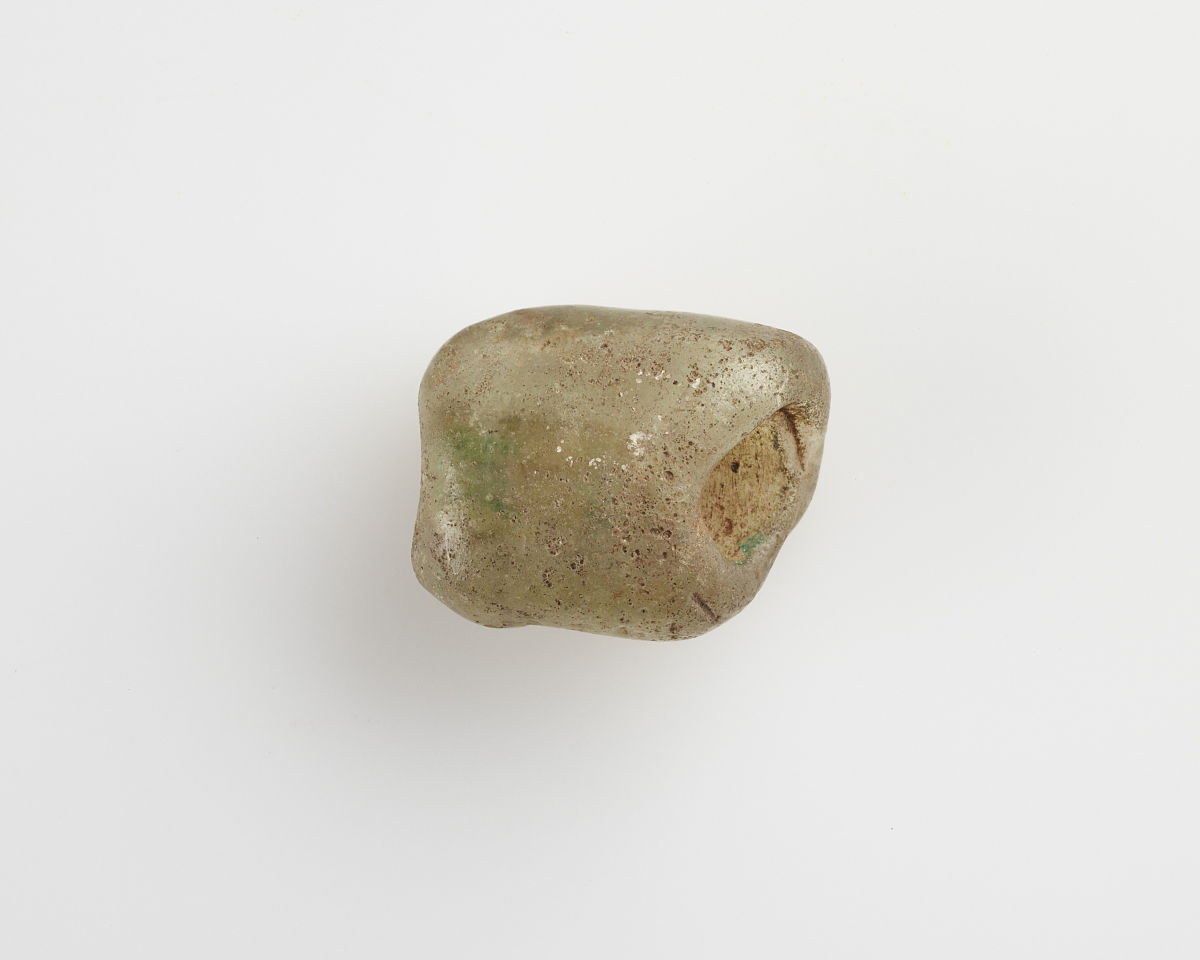 bead of irregular form; longitudinal bore, roman period, 30 bce-