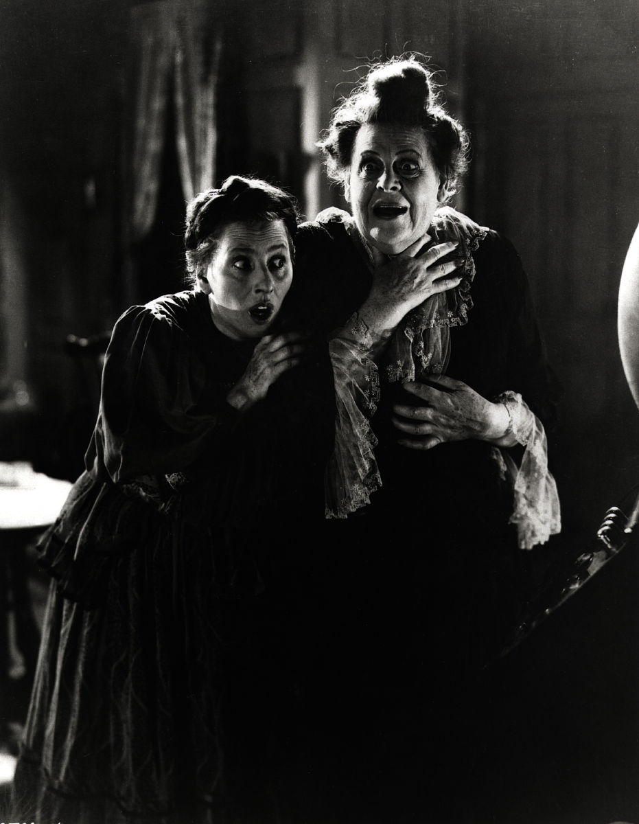polly moran and marie dressler gasp with fright in a gloomy scen