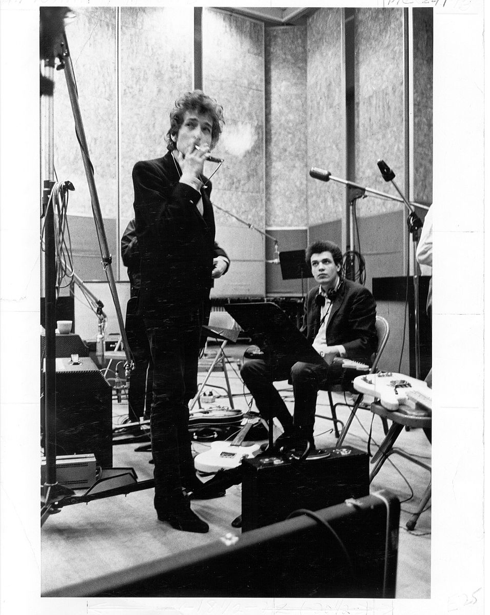 new york - summer 1965: bob dylan (holding a cigarette) and guit