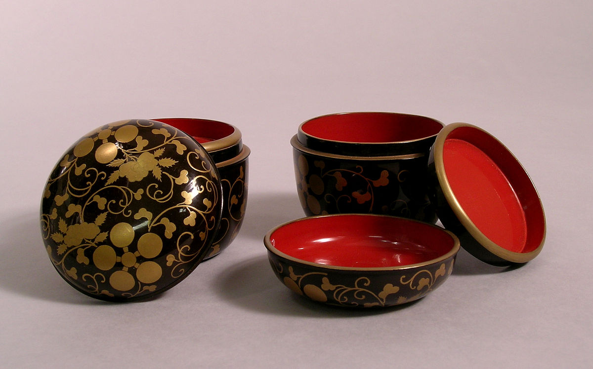 small cylindrical boxes with covers and removable tray decorated