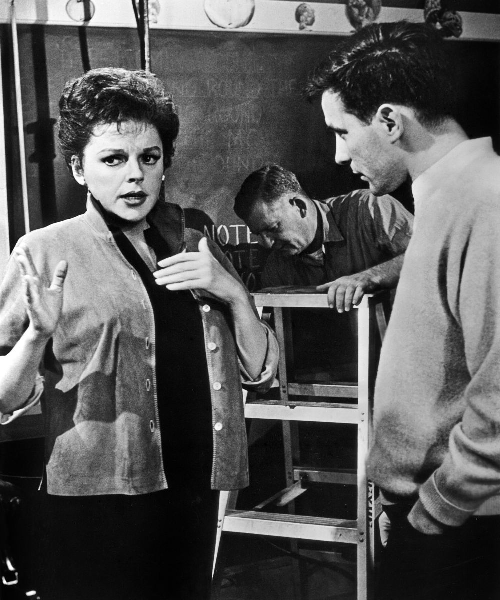 actress judy garland speaks with director john cassavetes on the