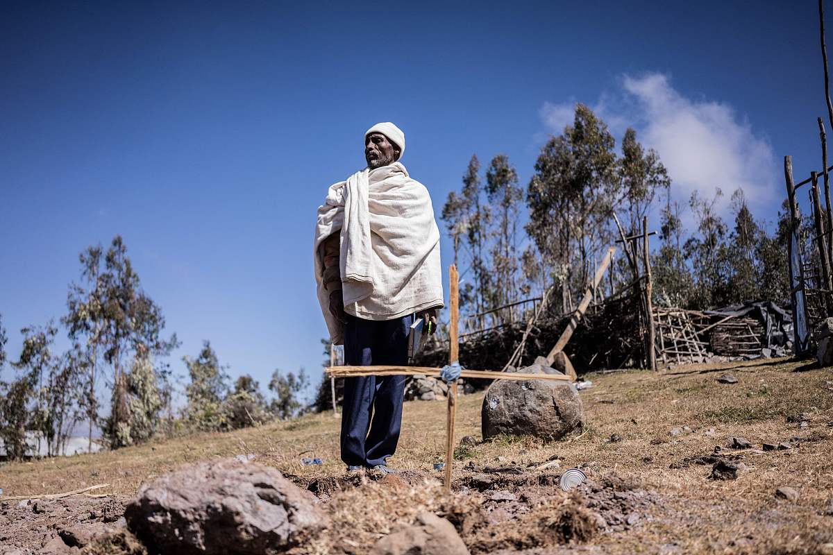 topshot - wu<strong>b</strong>eshet debbie stands in front of a grave in mesobit
